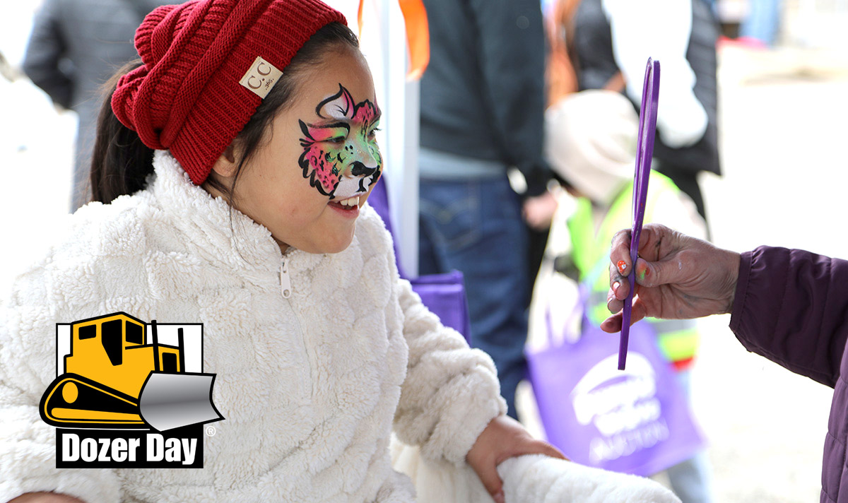 Future foreman directing face painters.