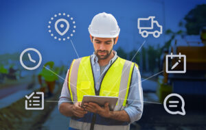 Construction worker using tablet outdoors.