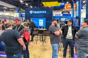Tractics team demonstrating heavy civil construction management software to contractors at the CONEXPO trade show booth