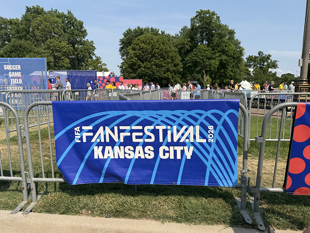 FIFA Fan Festival Kansas City 2026 sign displayed near activity areas and festival attendees.